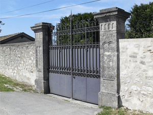 THE JEWISH CEMETERY IN EPERNAY, MARNE: The Jewish Cemetery, very discreet, hiding behind an enclosure of high walls, coupled with an impenetrable barrier of vegetation, which leaves absolutely nothing glimpse from outside. Only the pattern shaped tablets of the Law on the columns of the door could possibly suggest to the initiated the Jewish character of the place.