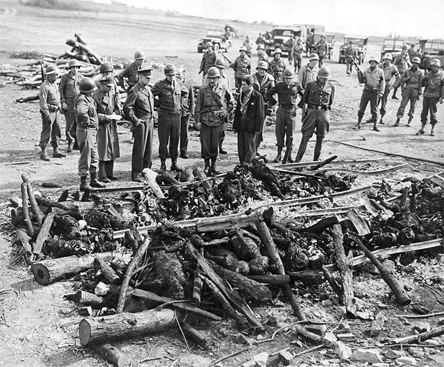 HOLOCAUST: April 12, 1945: Generals Eisenhower, Omar Bradley and George S. Patton inspect, at Ohrdruf forced labor camp, an improvised crematory pyre.