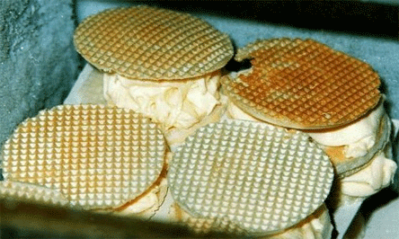 IRANIAN - PERSIAN RECIPES: TRADITIONAL IRANIAN ICE CREAM OFTEN CONTAINS FLAKES OF FROZEN CLOTTED CREAM AND IS MOST COMMONLY NATURALLY FLAVOURED WITH SAFFRON AND ROSE WATER. IT IS USUALLY SERVED SANDWICHED BETWEEN TWO THIN CRISPY WAFFLES.