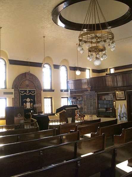 JEWISH IOWA: The interior of B'nai Jacob Synagogue in Ottumwa, Iowa, from the north looking toward the Bimah with the Torah ark behind it and the former women's balcony (mechitza) above. When the synagogue was built in 1915, the bimah was in the center of the room, directly below the chandelier. 5 December 2010, Photo: Douglas W. Jones.